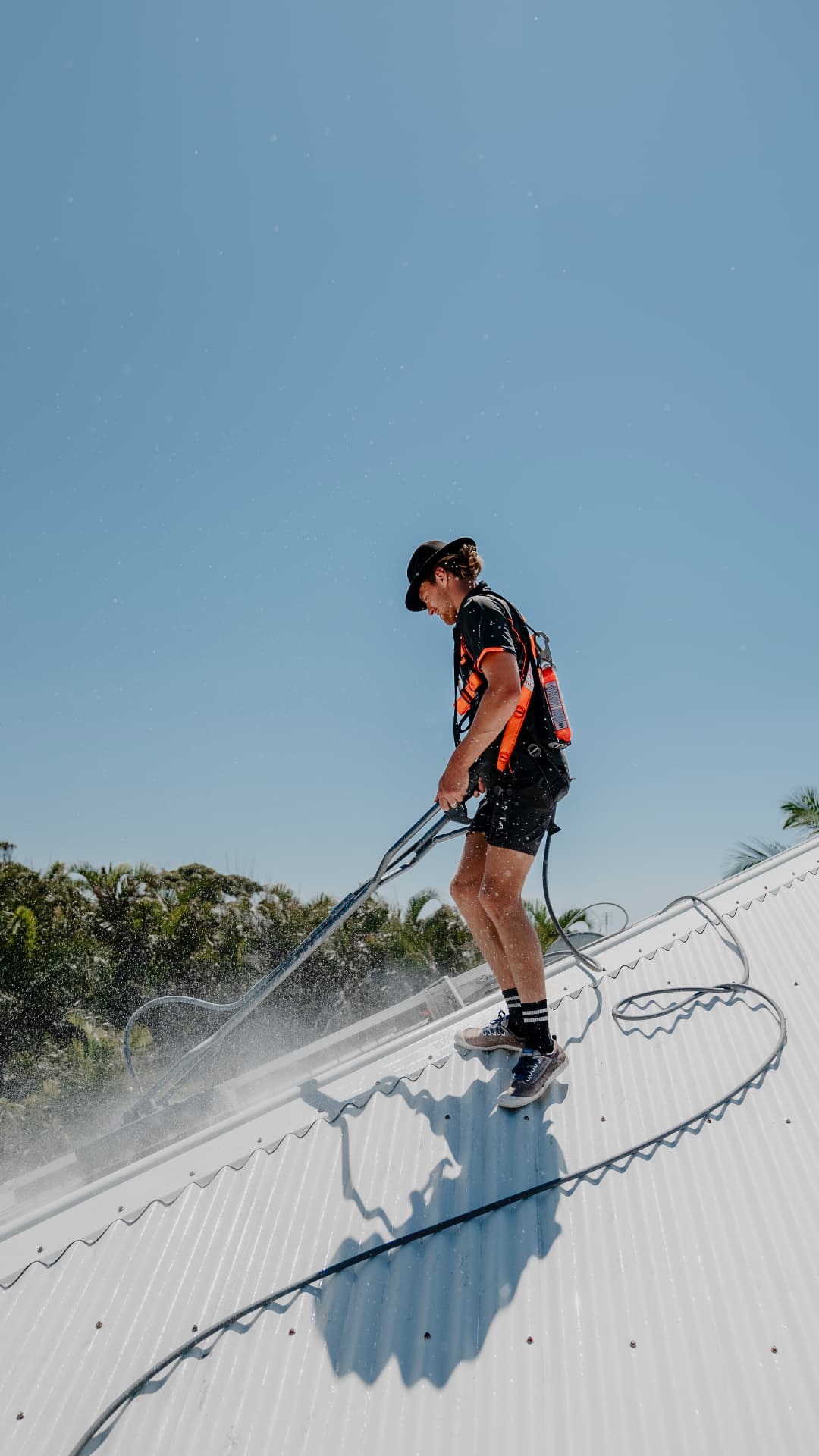 Pressure washing a metal roof on the Sunshine Coast